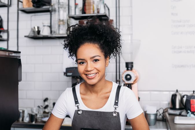 Portrait of smiling barista in cafe