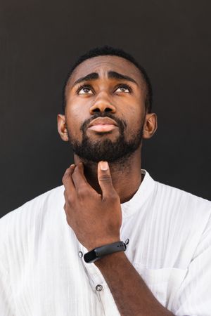 Black man in trendy clothes in city