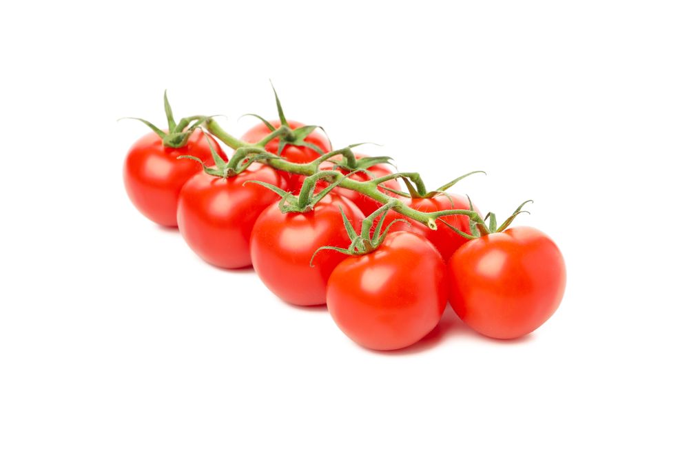 Fresh ripe tomatoes isolated on plain background