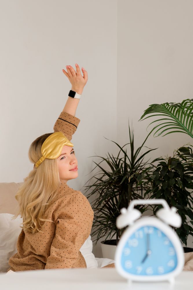 Woman stretching with smartwatch, plants in background
