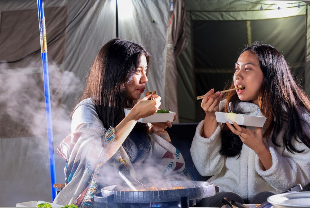 Two Young People Eating Beef