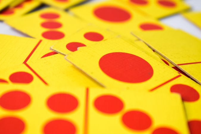 Close up of red and yellow domino playing cards