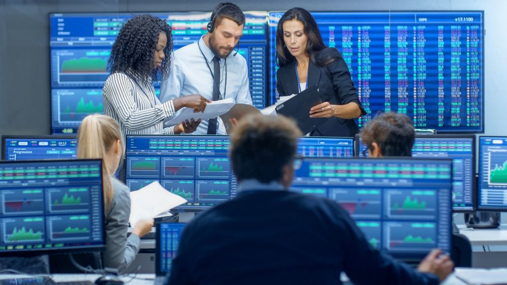 Multi-Ethnic Team of Traders is Busy Working at the Stock Exchange Office.