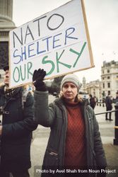 London, England, United Kingdom - March 5 2022: Woman with sign about NATO at anti-war protest 5knpo0