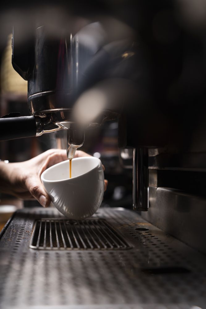 Barista using coffee machine