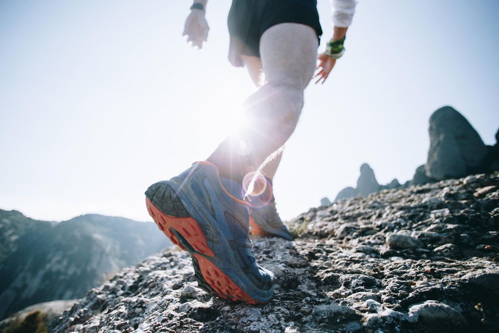 Close up of a runner’s trainers with sun flare