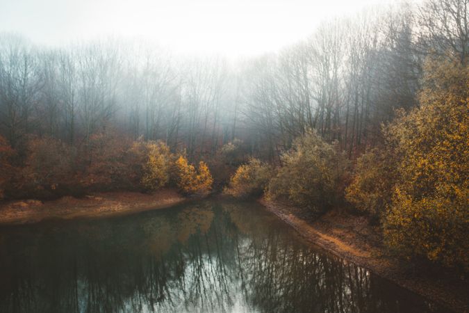 Tranquil water of lake in mist