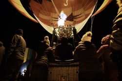 Hudson, WI, USA - February 8th, 2020: Hot air balloon being inflated for take off at dusk