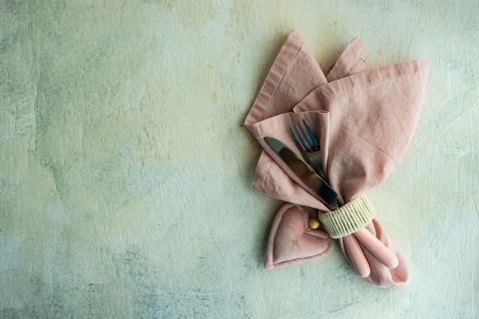 St. Valentine's Day card with cutlery wrapped in pink napkin