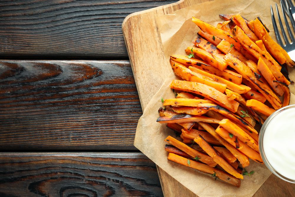 Concept of tasty food, fried sweet potato, space for text