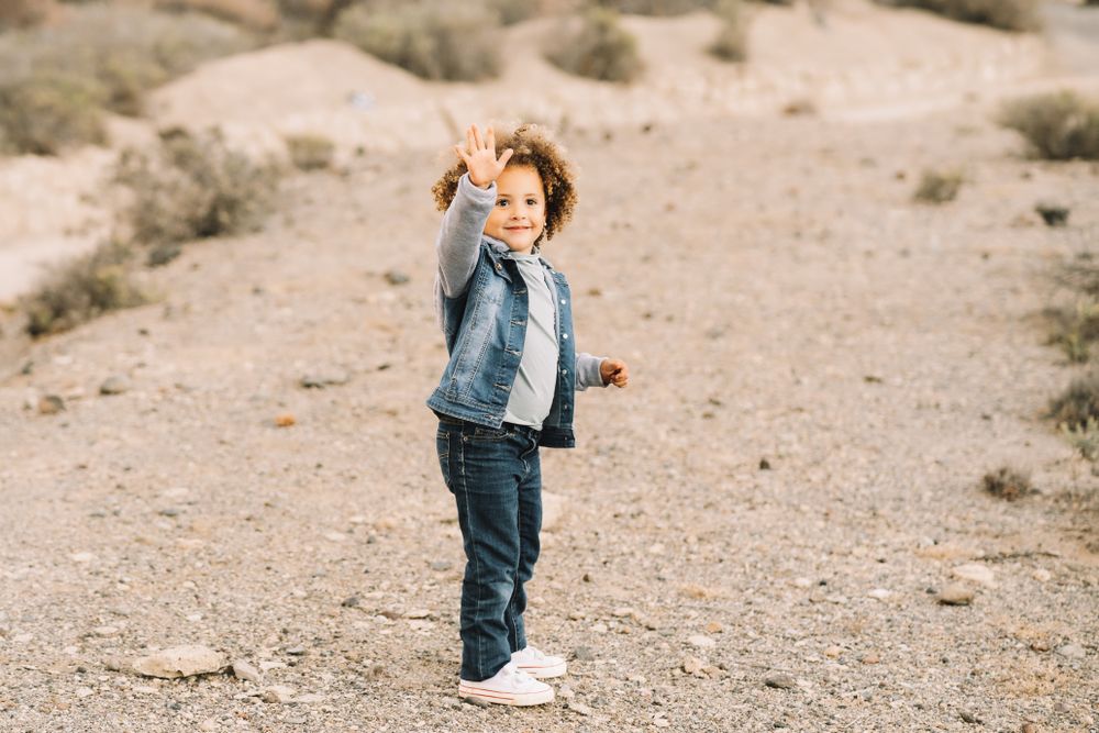 curly toddler on nature