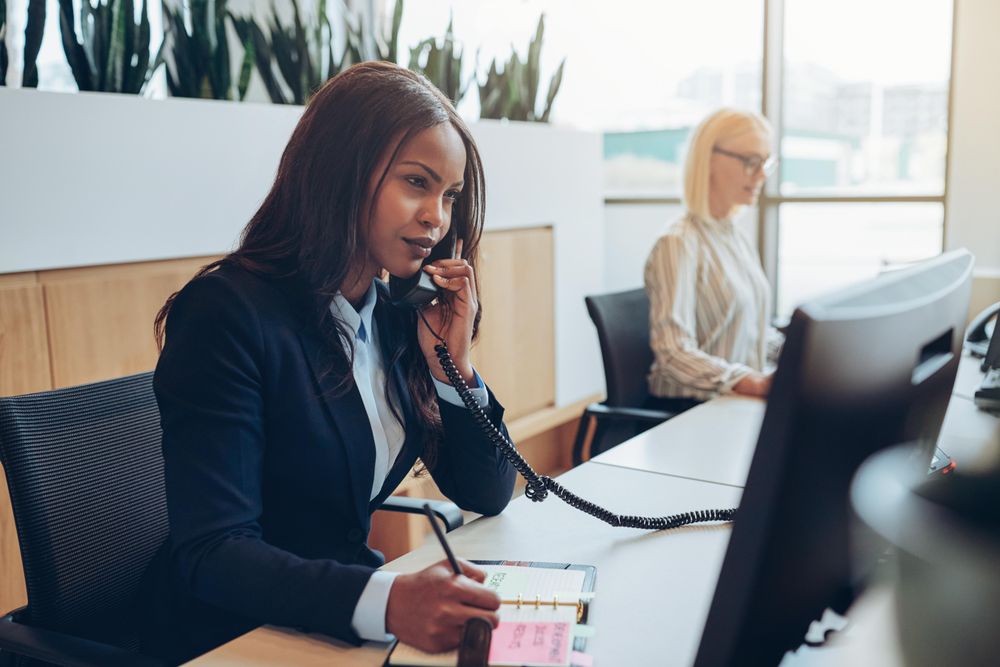 Two women at the front desk