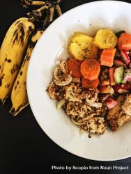 Plate of sauteed vegetables with bananas 5qBQE4