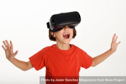 Excited girl in VR glasses and gesturing with arms opened 0yJrq5