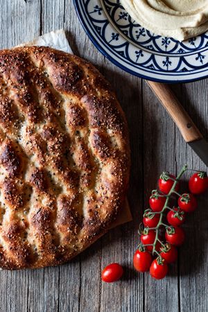 Ramazan pidesi near spices and tomatoes