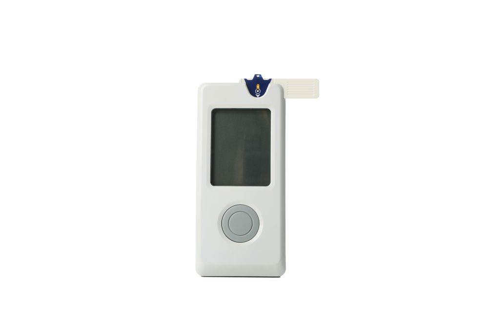 Blood glucose meter isolated on light background