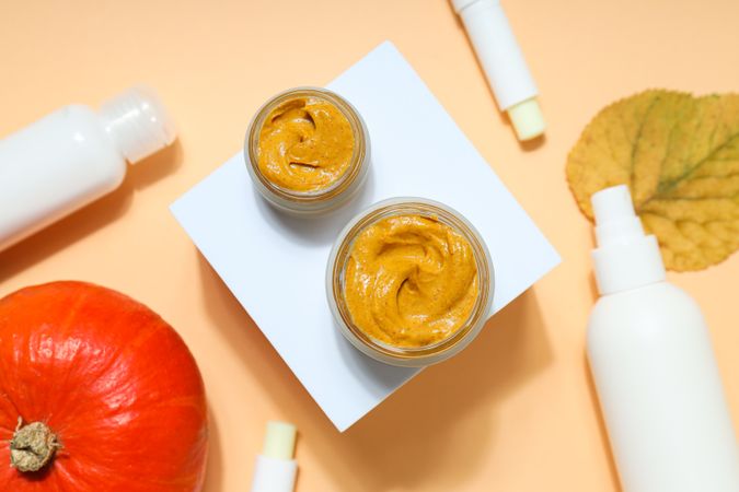 Skin care and face care concept - pumpkin cosmetic