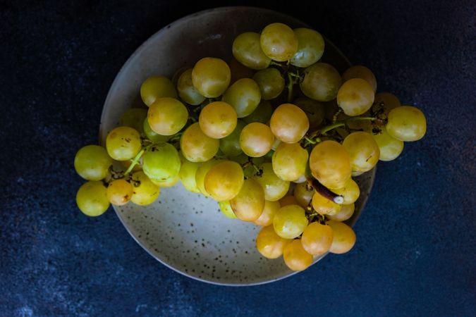 Plate of grapes on ceramic plate