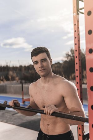Shirtless man on sports ground