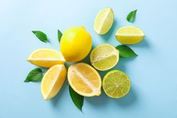 Flat lay composition with citrus on color background, space for text