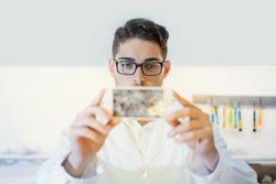 Man showing broken smartphone display