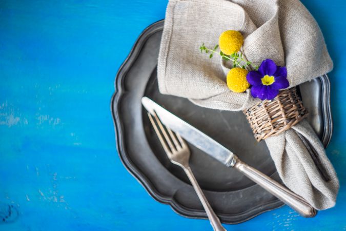 Easter table setting on bright blue table