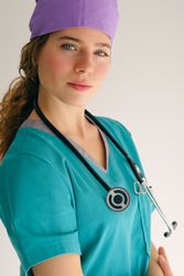 Professional female doctor in scrubs