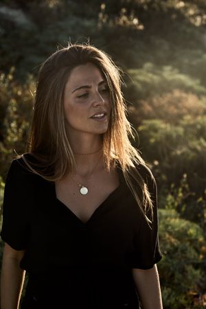 Cheerful woman looking away