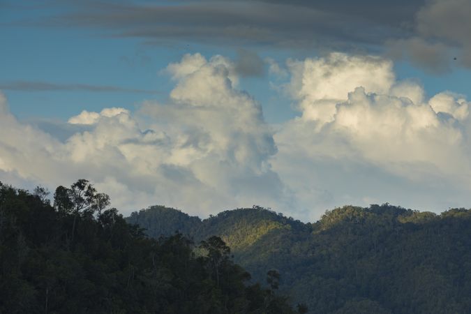 Beautiful clouds over the mountains of Waiego Island, Southeast Asia