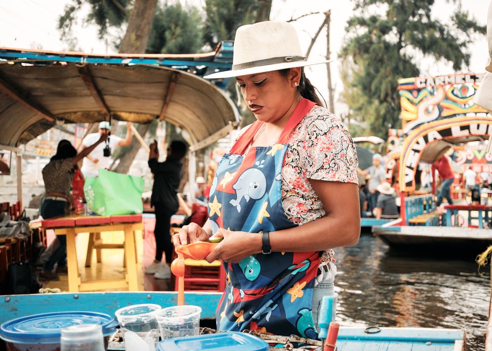 Woman squeezing lime on the river