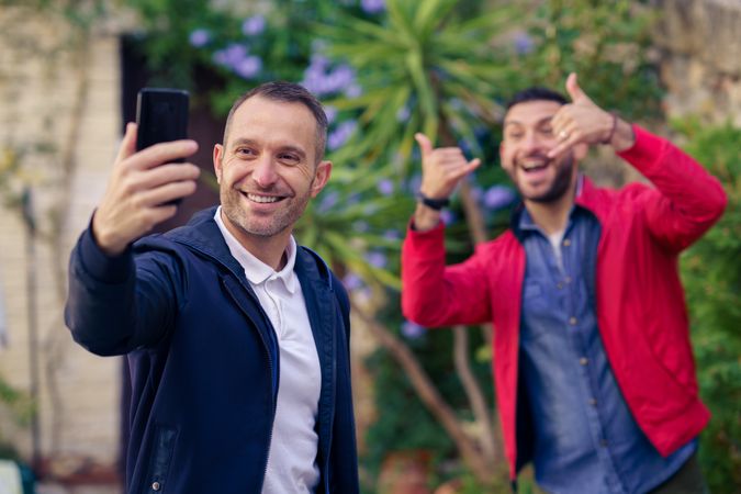 Two men making faces for fun selfie