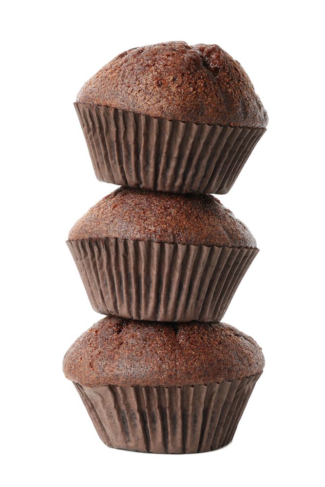 Delicious chocolate muffins isolated on blank background