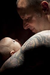 Young Father Holding His Newborn Baby