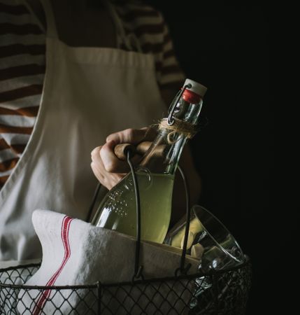 Female with bottle of elderflower syrup