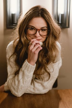 female at cafe table