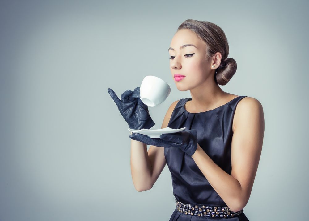 Vintage female model with coffee cup