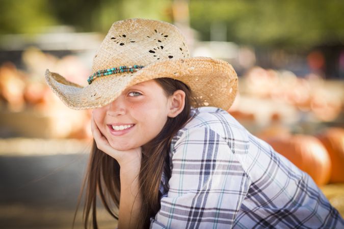 Preteen Girl in Cowboy Hat Portrait at the Pumpkin Patch