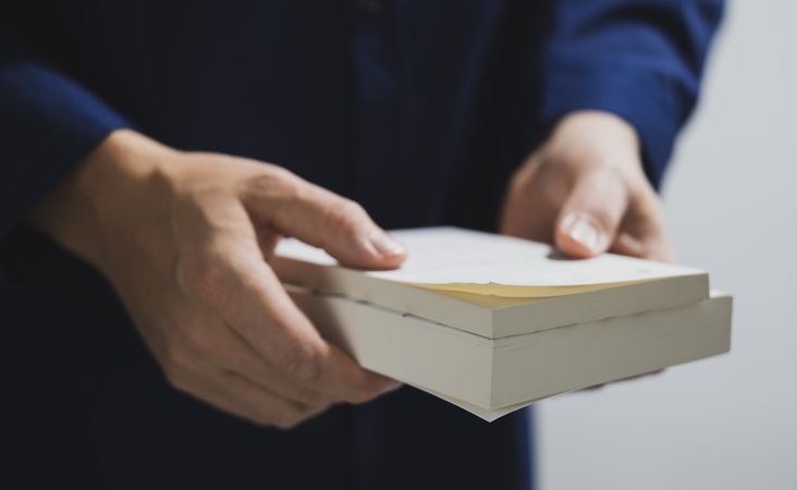Man Holding Books Education Concept
