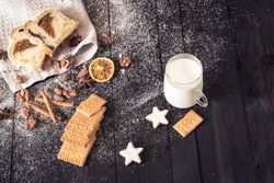 Sweets and roasted nuts on wooden table