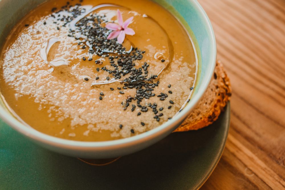 Tasty soup puree with seeds in bowl