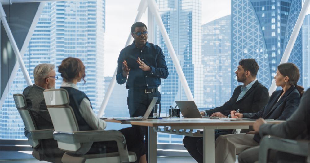 Diverse Investors Listening, Discussing With Confident Black Businessman Growth Strategy For Startup.