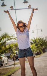 Young girl with a skateboard outdoor