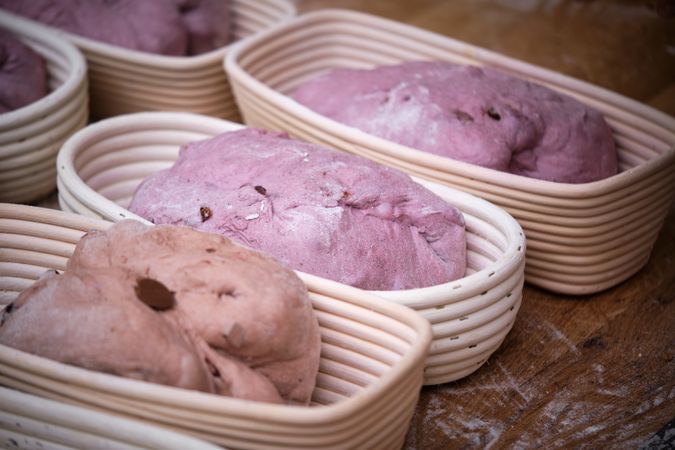 Leavened bread dough in the moulds resting to be baked.