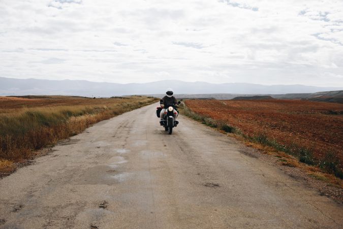 Person on motorcycle on remote road