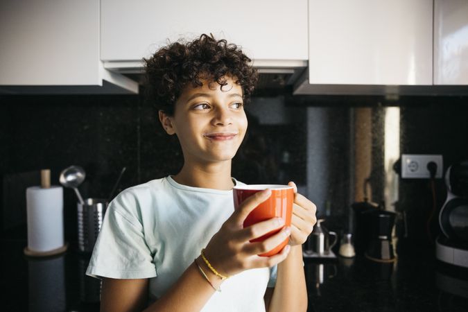 Girl drinking a cup of milk