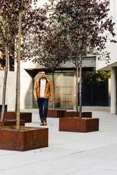 Stylish guy walking on street