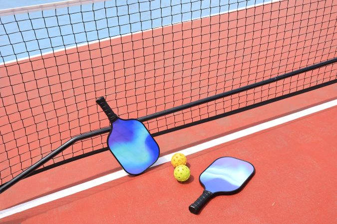 Pickleball Balls, Net, and Paddle in the Pickle Court