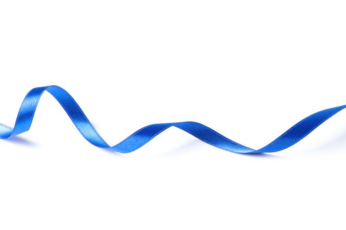 Blue ribbon isolated on plain background. Gift concept