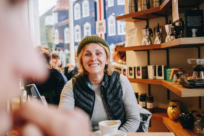 Smiling woman in cozy cafe