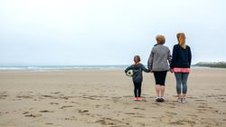 Three female generations watching the sea